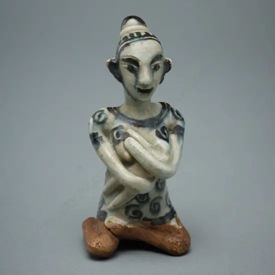 A Sawankhalok stoneware figure (tukatha),